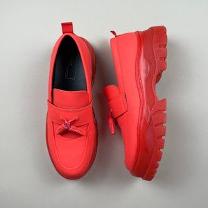 Orange loafers with chunky soles